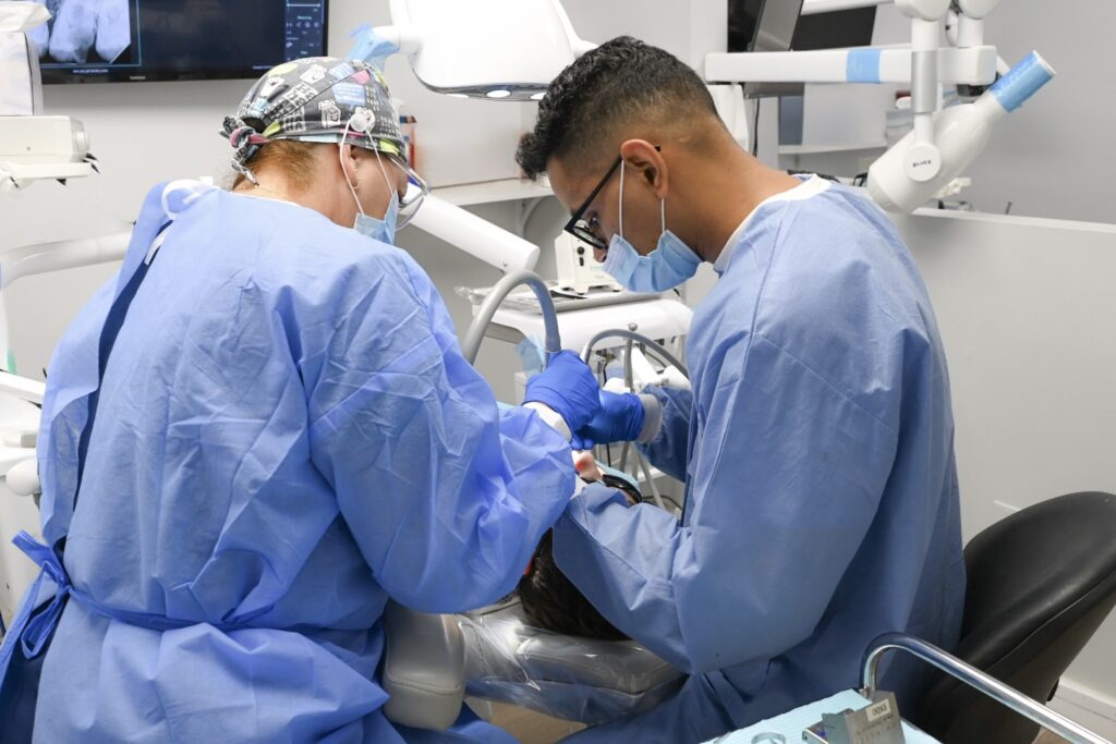 Patient receiving a dental implant procedure at West Brickell Dental in Miami.